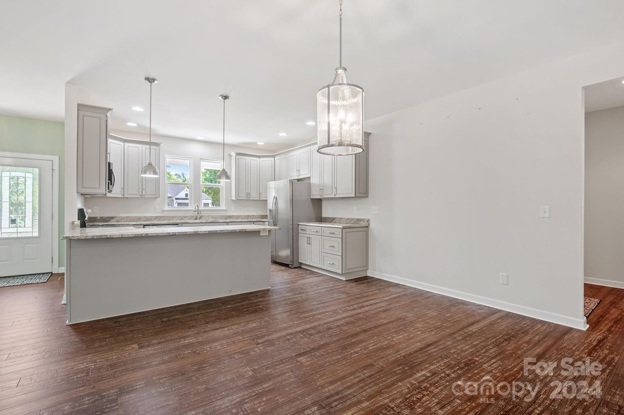 4655 Old Hickory Road Lancaster, SC 29720 - Photo 12 of 35 a view of kitchen with granite countertop cabinets and refrigerator