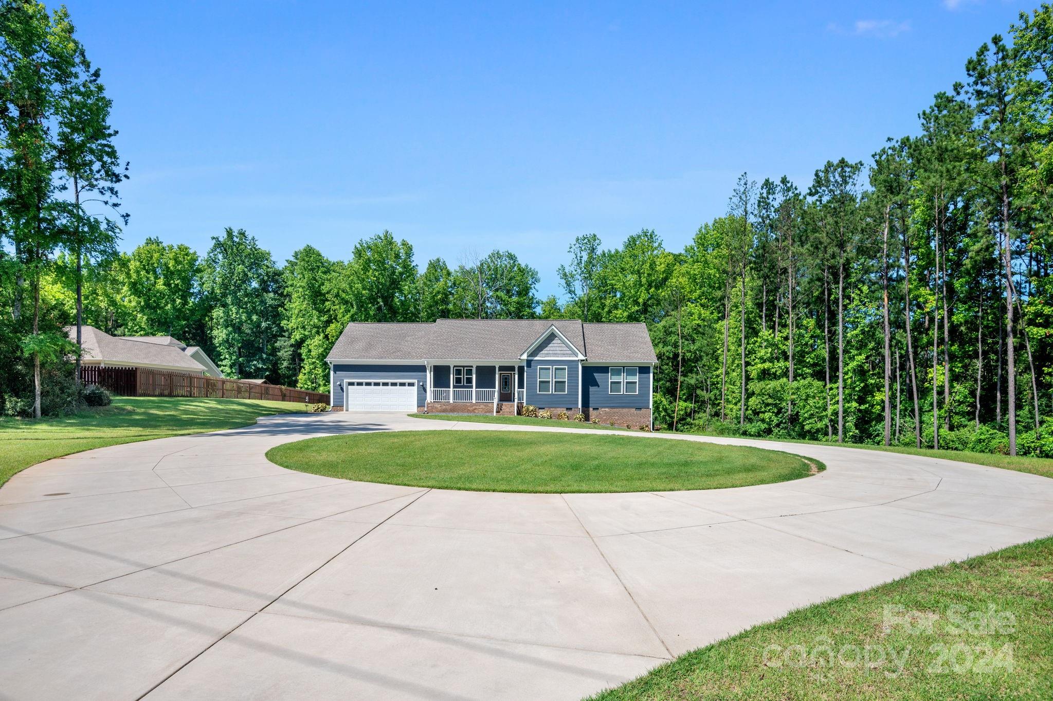 4655 Old Hickory Road Lancaster, SC 29720 - Photo 3 of 35 a front view of a house with a yard and trees