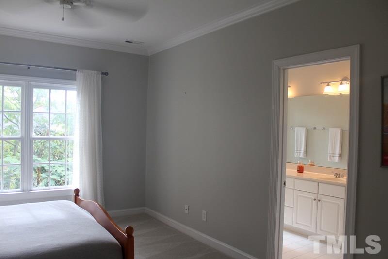 1322 Cameron View Court Raleigh, NC 27607 - Photo 16 of 22 a bedroom with a bed and a mirror