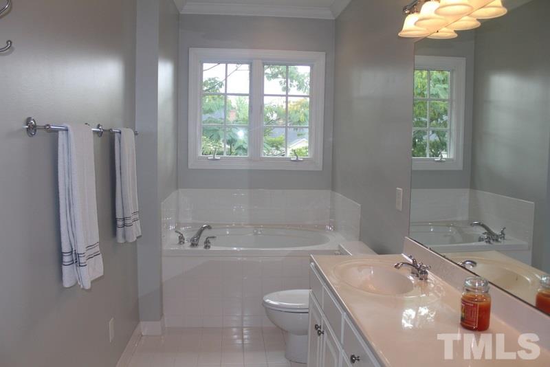 1322 Cameron View Court Raleigh, NC 27607 - Photo 17 of 22 a bathroom with a sink a toilet and tub