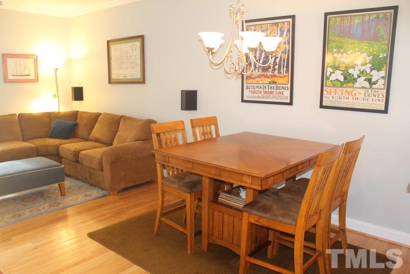 1322 Cameron View Court Raleigh, NC 27607 - Photo 5 of 22 a view of a dining room with furniture and a large window