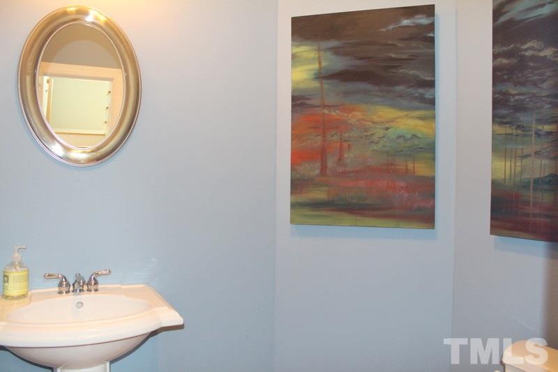 1322 Cameron View Court Raleigh, NC 27607 - Photo 9 of 22 a bathroom with a mirror and a sink