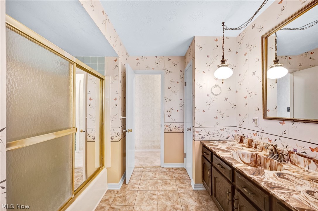6452 Carsten Road Medina, OH 44256 - Photo 21 of 41 Bathroom with shower / bath combination with glass door, vanity, and tile flooring