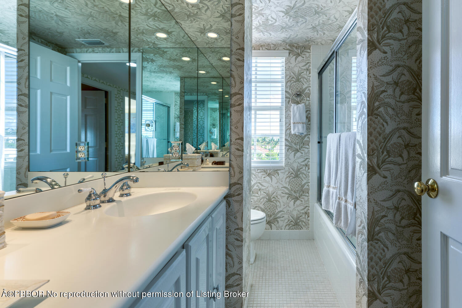 330 Cocoanut Row, Unit 5B Palm Beach, FL 33480 - Photo 24 of 32 a bathroom with a tub sink and mirror