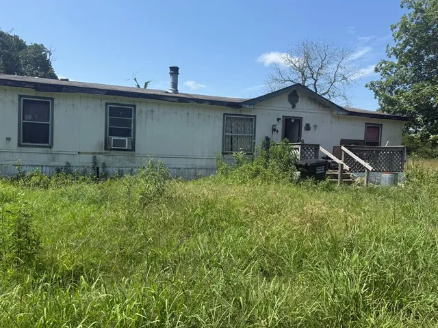 a backyard of a house with seating space