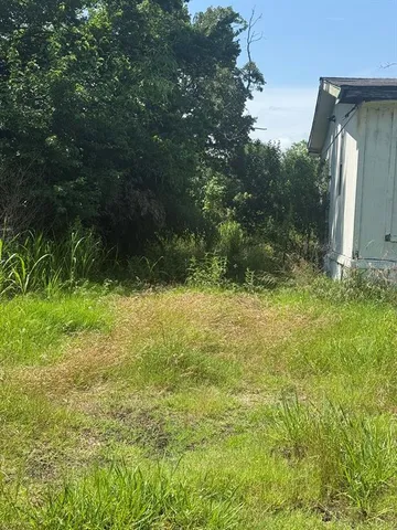 a view of outdoor space and a yard