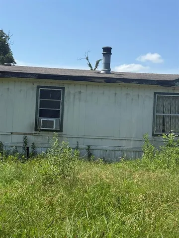 a view of a backyard of a house