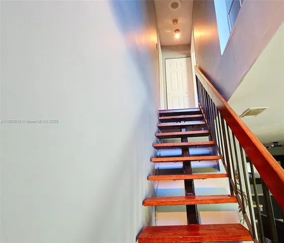 a view of front door with wooden floor