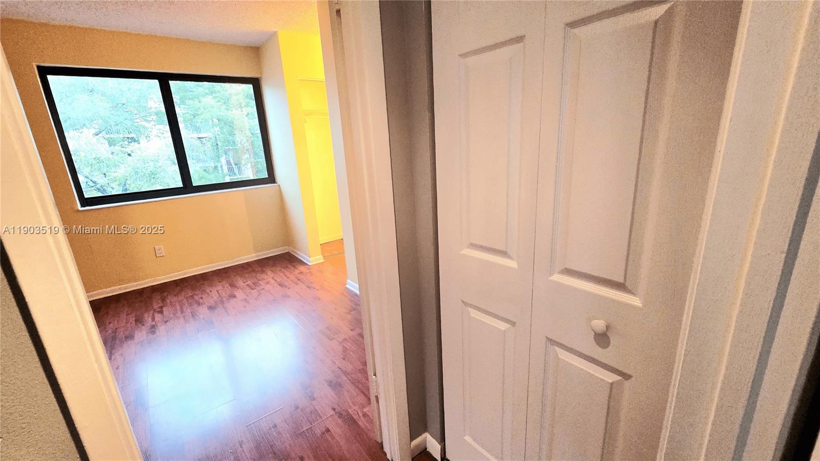 10515 Southwest 153rd Court, Unit 3 Miami, FL 33196 - Photo 14 of 26 a view of front door with wooden floor