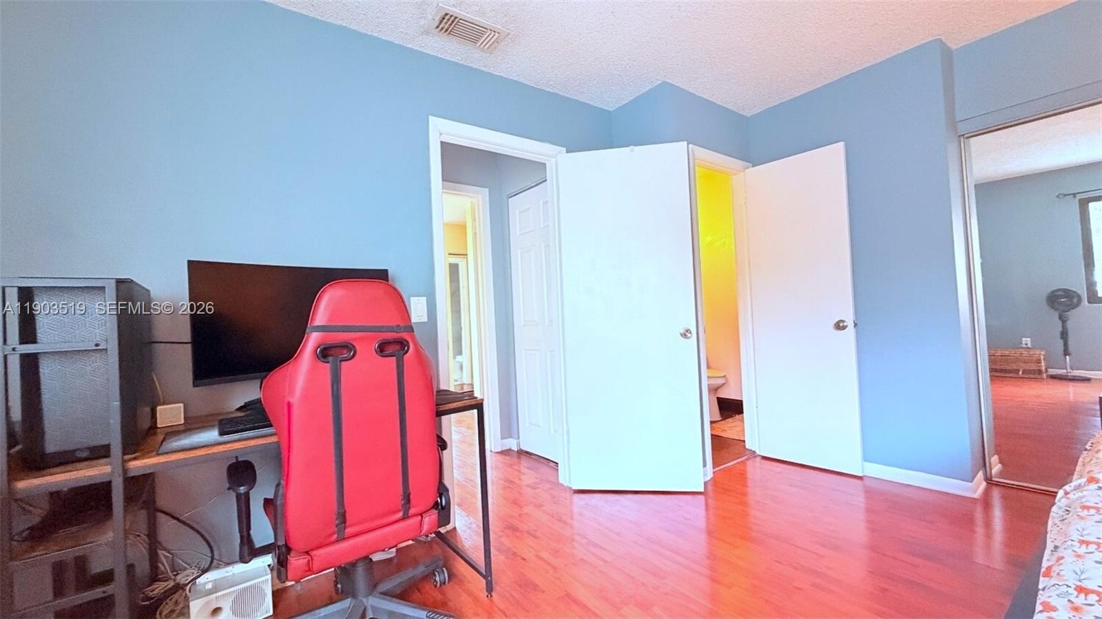 10515 Southwest 153rd Court, Unit 3 Miami, FL 33196 - Photo 16 of 32 wooden floor and a workspace