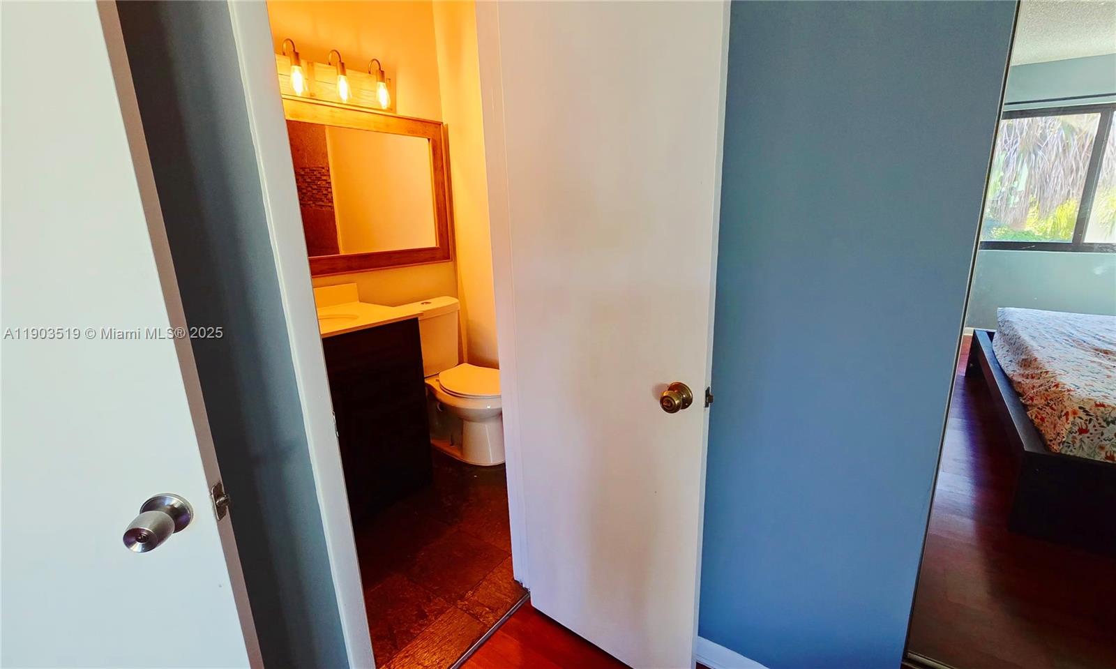 10515 Southwest 153rd Court, Unit 3 Miami, FL 33196 - Photo 23 of 26 a bathroom with a sink and a mirror