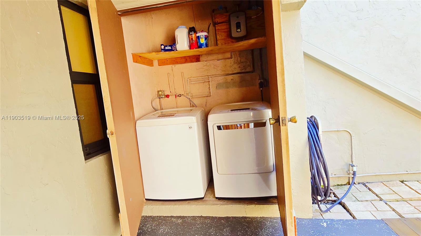 10515 Southwest 153rd Court, Unit 3 Miami, FL 33196 - Photo 24 of 26 a utility room with dryer and washer