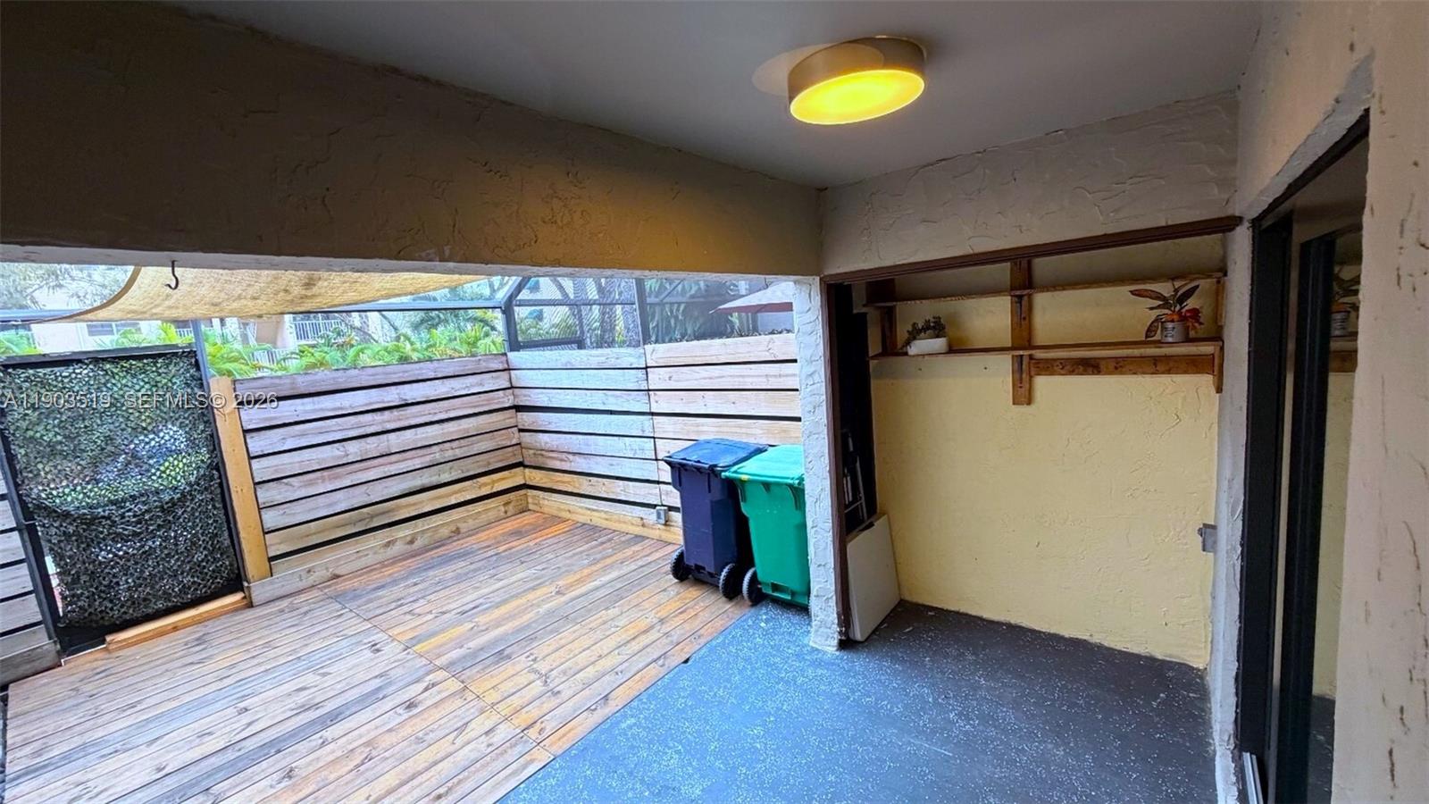 10515 Southwest 153rd Court, Unit 3 Miami, FL 33196 - Photo 30 of 32 a view of a room with wooden floor and a window