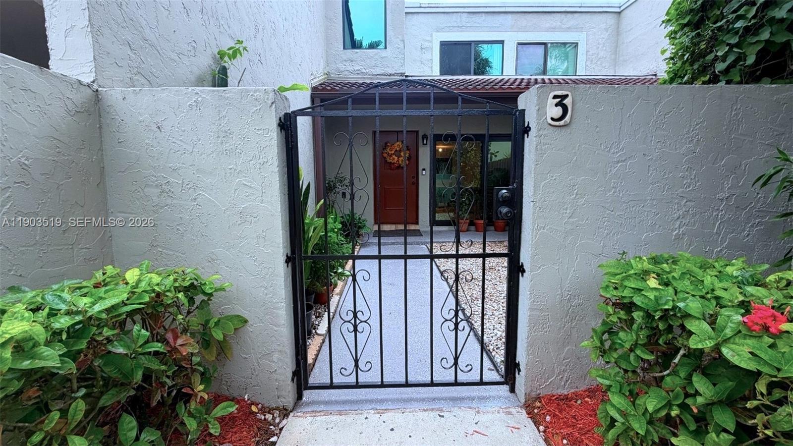 10515 Southwest 153rd Court, Unit 3 Miami, FL 33196 - Photo 4 of 32 a view of a entryway door of the house