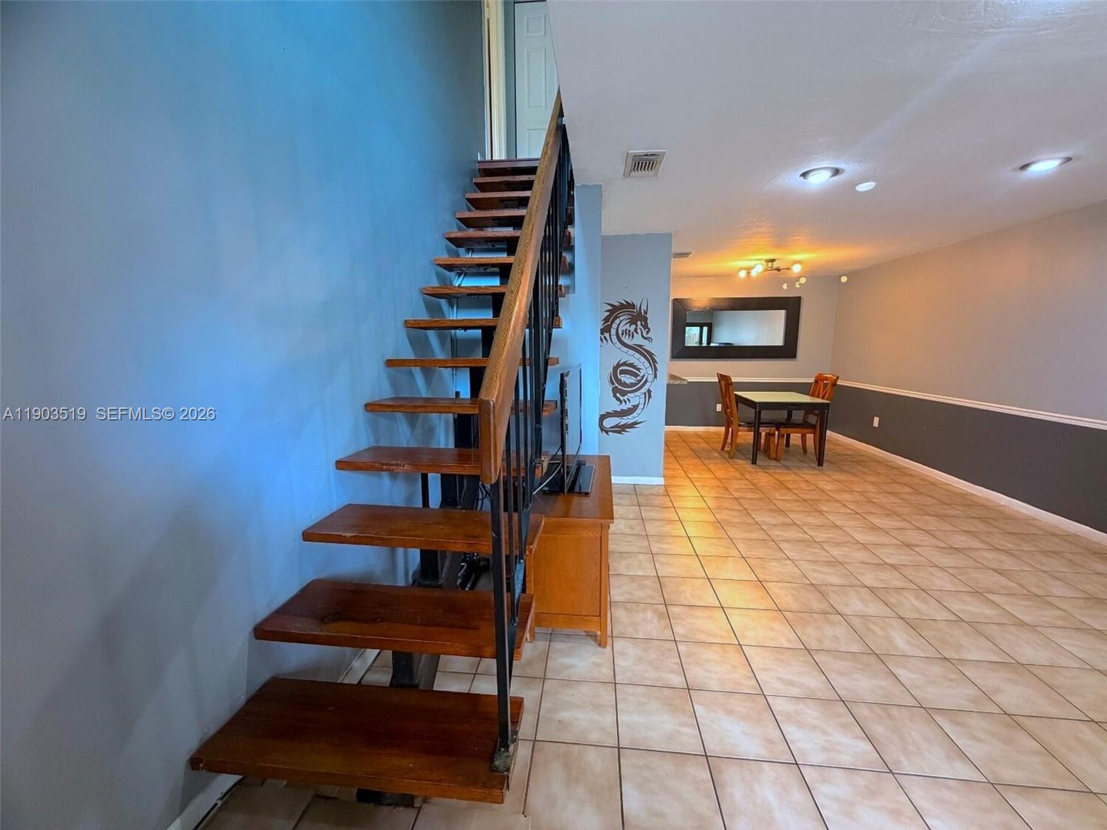 10515 Southwest 153rd Court, Unit 3 Miami, FL 33196 - Photo 6 of 32 a view of entryway and hall with wooden floor