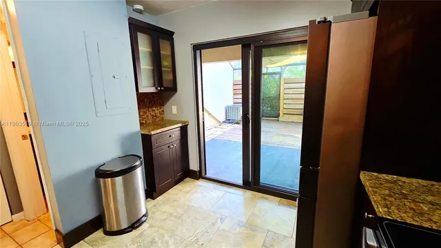 a kitchen with stainless steel appliances a refrigerator and a stove top oven