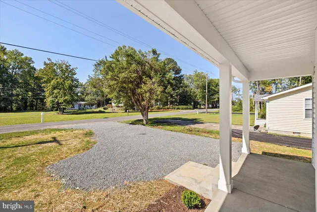 a view of a swimming pool and a yard