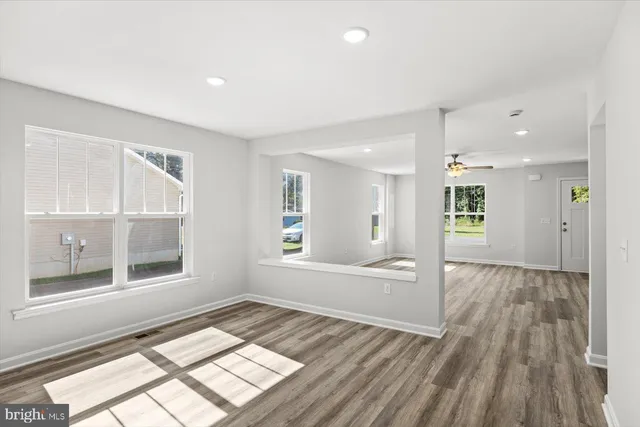 a view of an empty room and a window