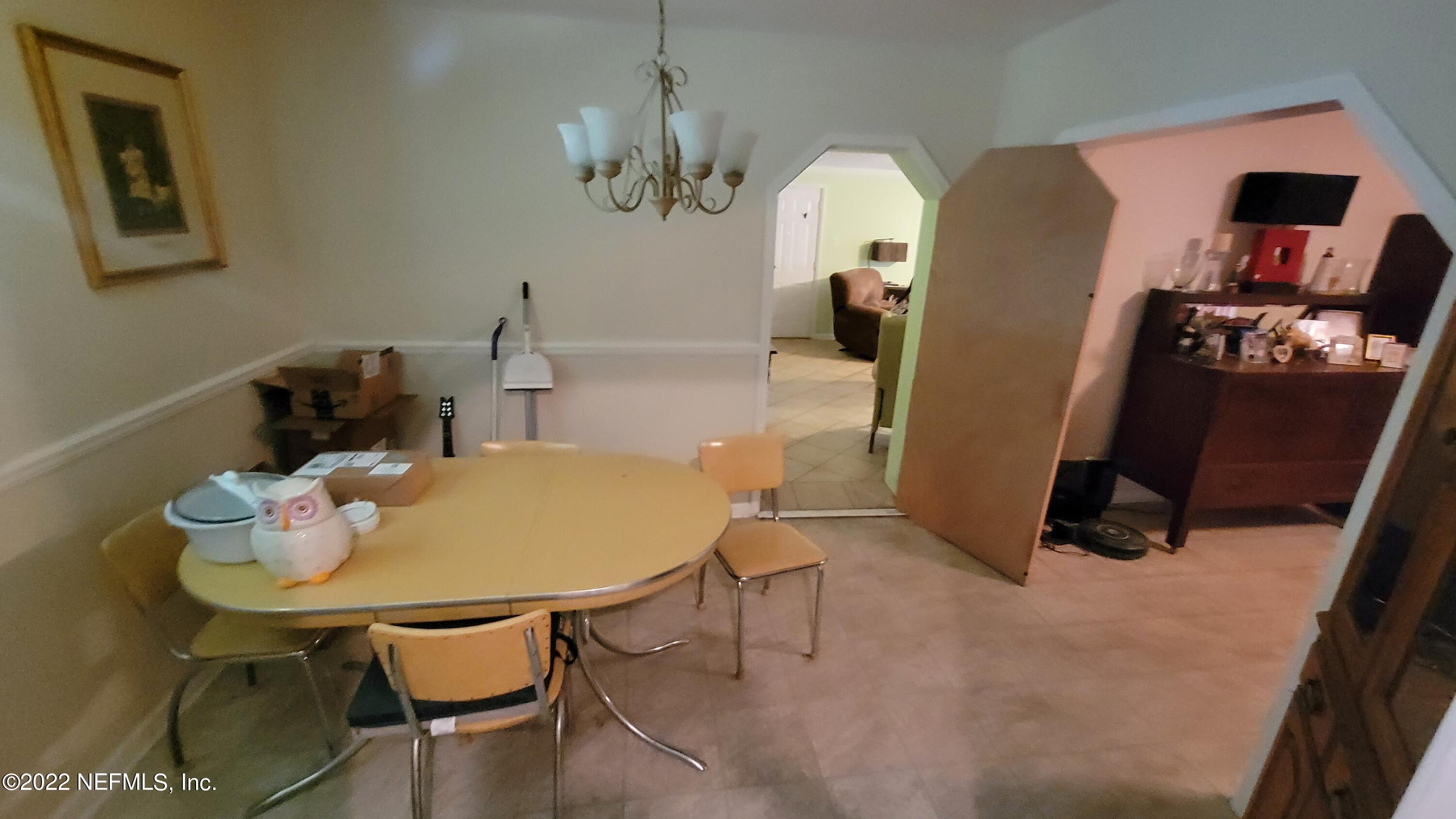 121 Jackson Road Jacksonville, FL 32225 - Photo 4 of 9 a view of a dining room with furniture