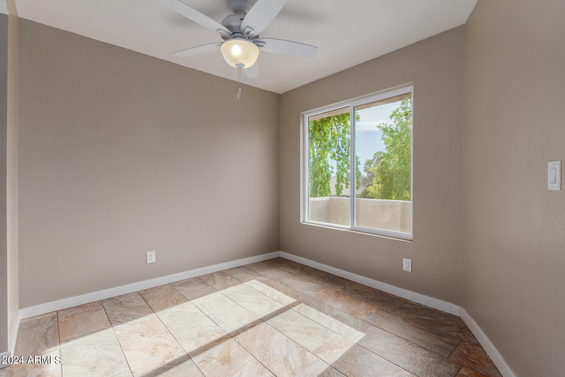 2834 South Ext Road, Unit 2058 Mesa, AZ 85210 - Photo 14 of 33 a view of an empty room with a window