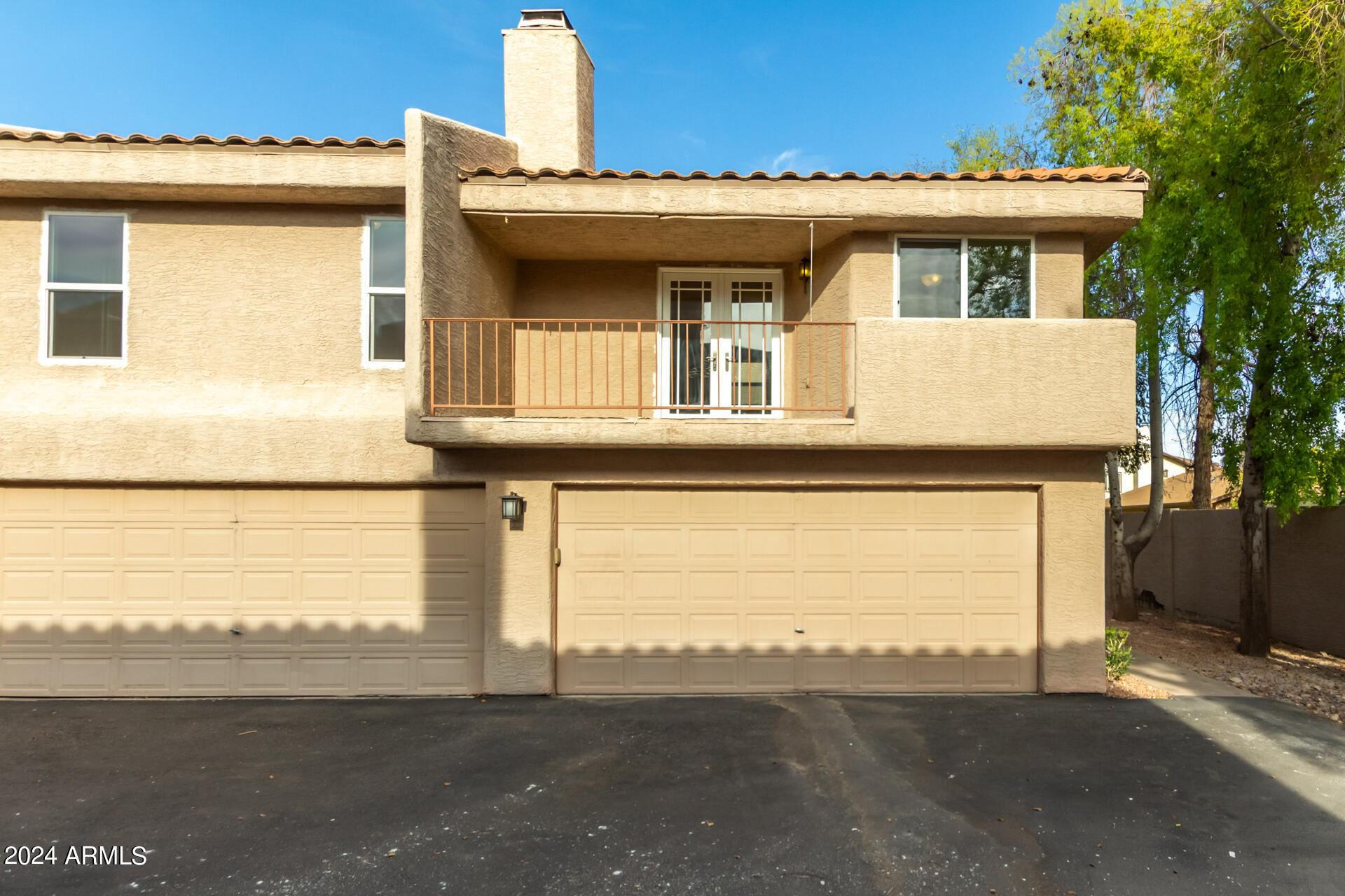 2834 South Ext Road, Unit 2058 Mesa, AZ 85210 - Photo 2 of 33 a front view of a house with a road