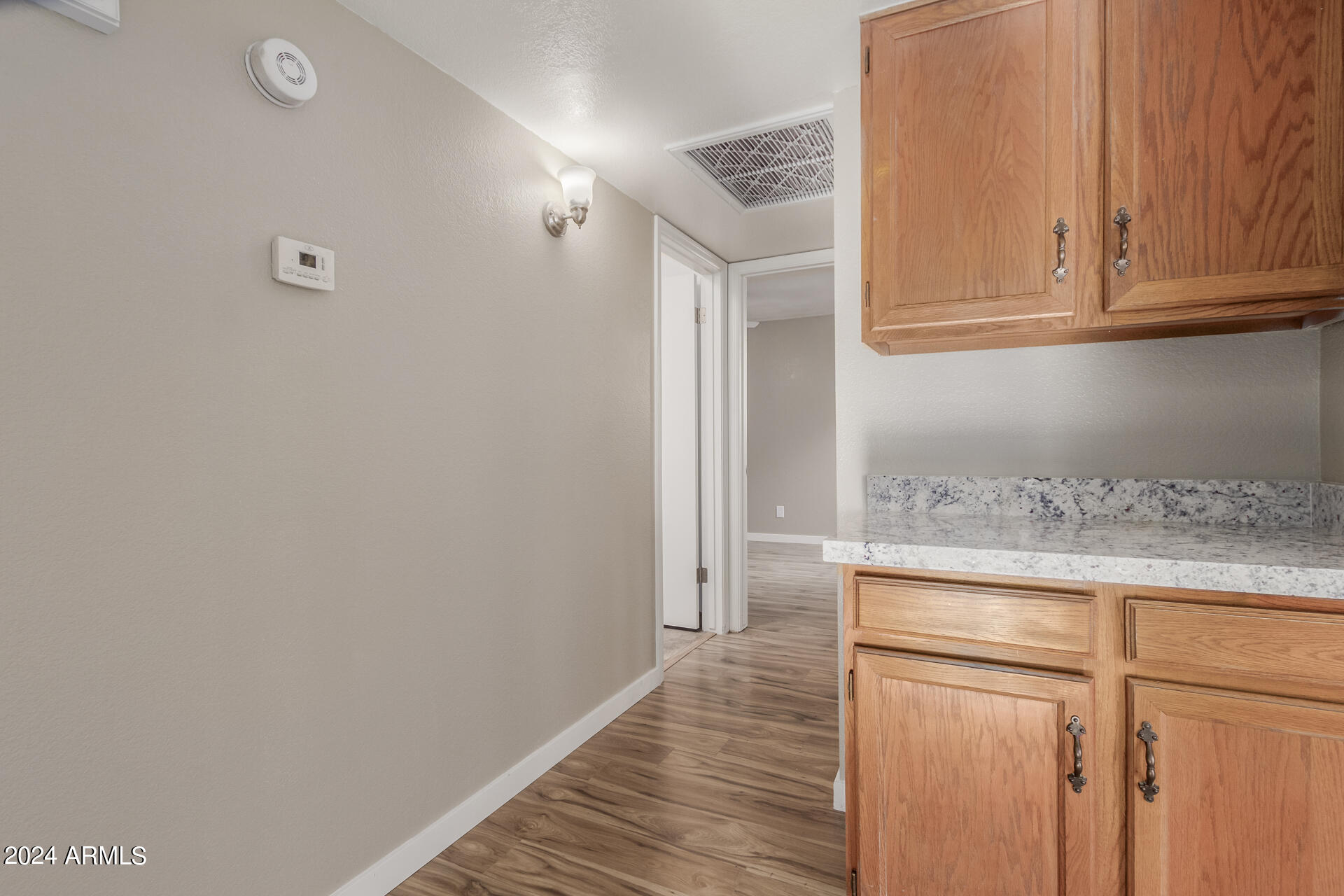2834 South Ext Road, Unit 2058 Mesa, AZ 85210 - Photo 26 of 33 a view of cabinets with wooden floor