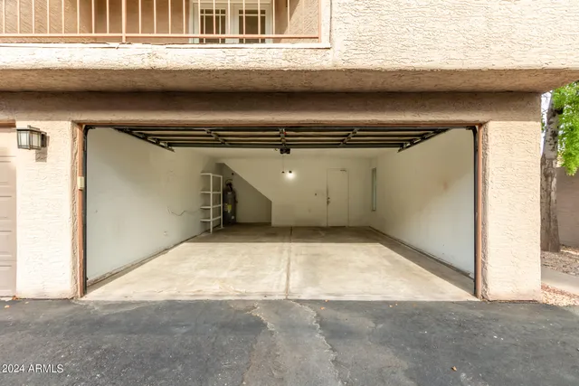 a view of a balcony with wooden floor and fence