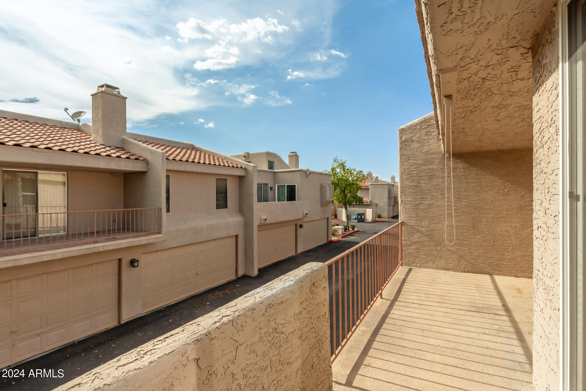 2834 South Ext Road, Unit 2058 Mesa, AZ 85210 - Photo 30 of 33 a front view of a house with a balcony