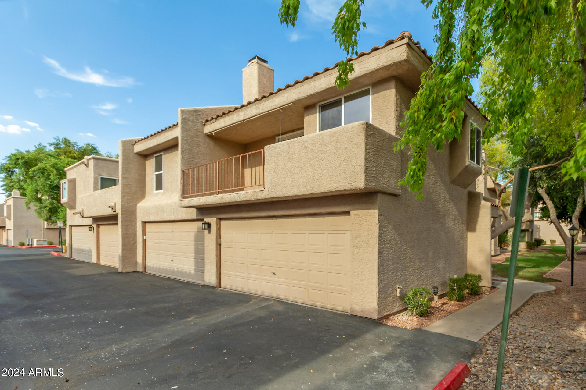 2834 South Ext Road, Unit 2058 Mesa, AZ 85210 - Photo 4 of 33 a front view of a house with parking