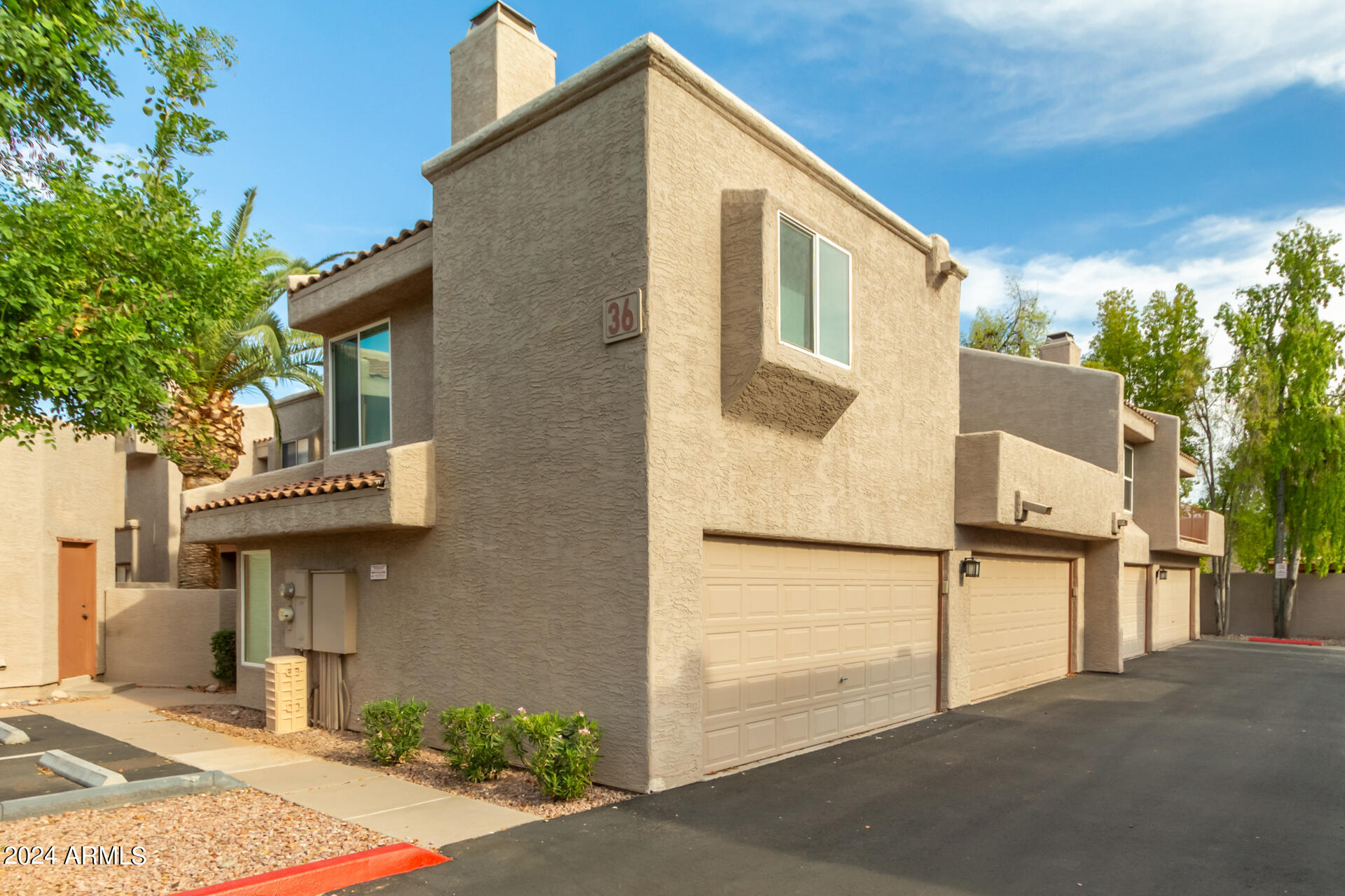 2834 South Ext Road, Unit 2058 Mesa, AZ 85210 - Photo 6 of 33 a view of a house with a street