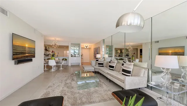 a view of a dining room with furniture and chandelier