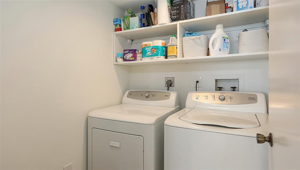 11 Sunset Drive, Unit 501 Sarasota, FL 34236 - Photo 34 of 63 a utility room with dryer and washer