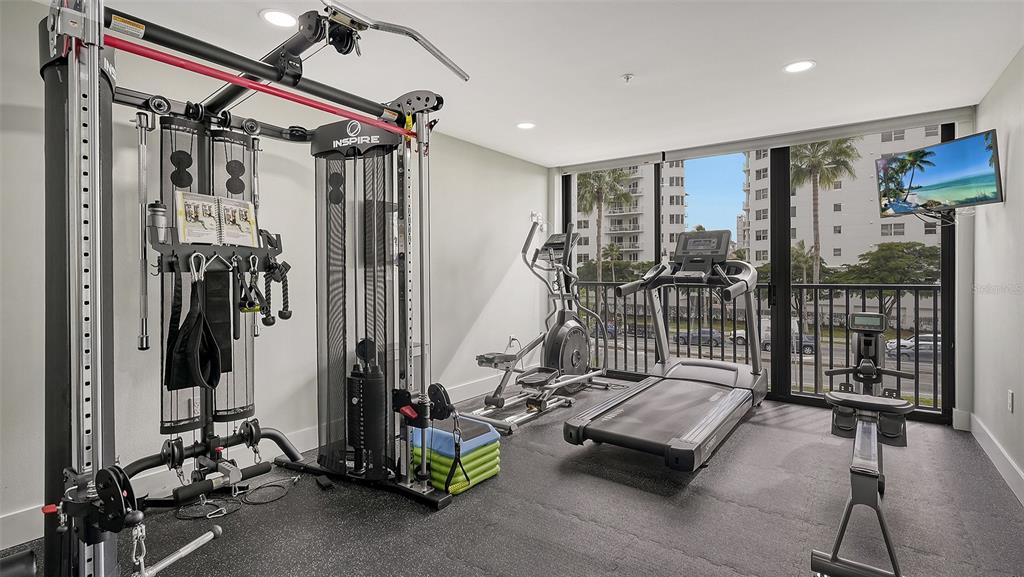 11 Sunset Drive, Unit 501 Sarasota, FL 34236 - Photo 55 of 63 a gym room with gym equipment