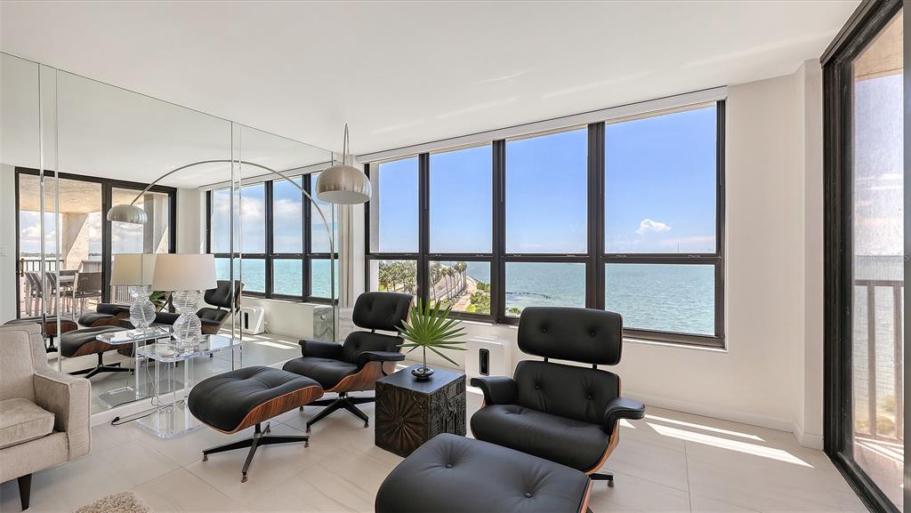 11 Sunset Drive, Unit 501 Sarasota, FL 34236 - Photo 10 of 63 a living room with furniture and a large window