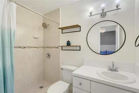 a bathroom with a sink and mirror