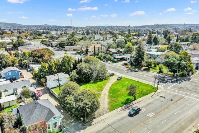 an aerial view of residential houses with outdoor space
