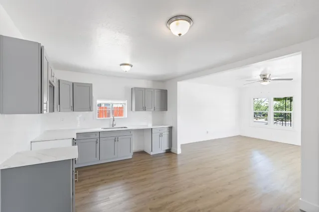 a view of kitchen with wooden floor and window