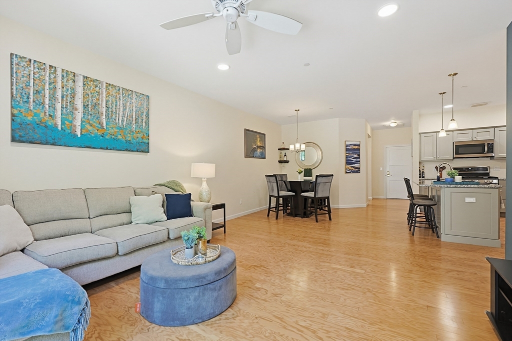 200 Revere Street, Unit 4209 Canton, MA 02021 - Photo 18 of 35 a living room with furniture and kitchen view