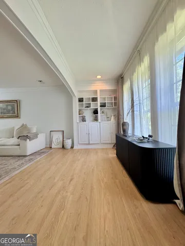 a spacious bedroom with a bed and a window