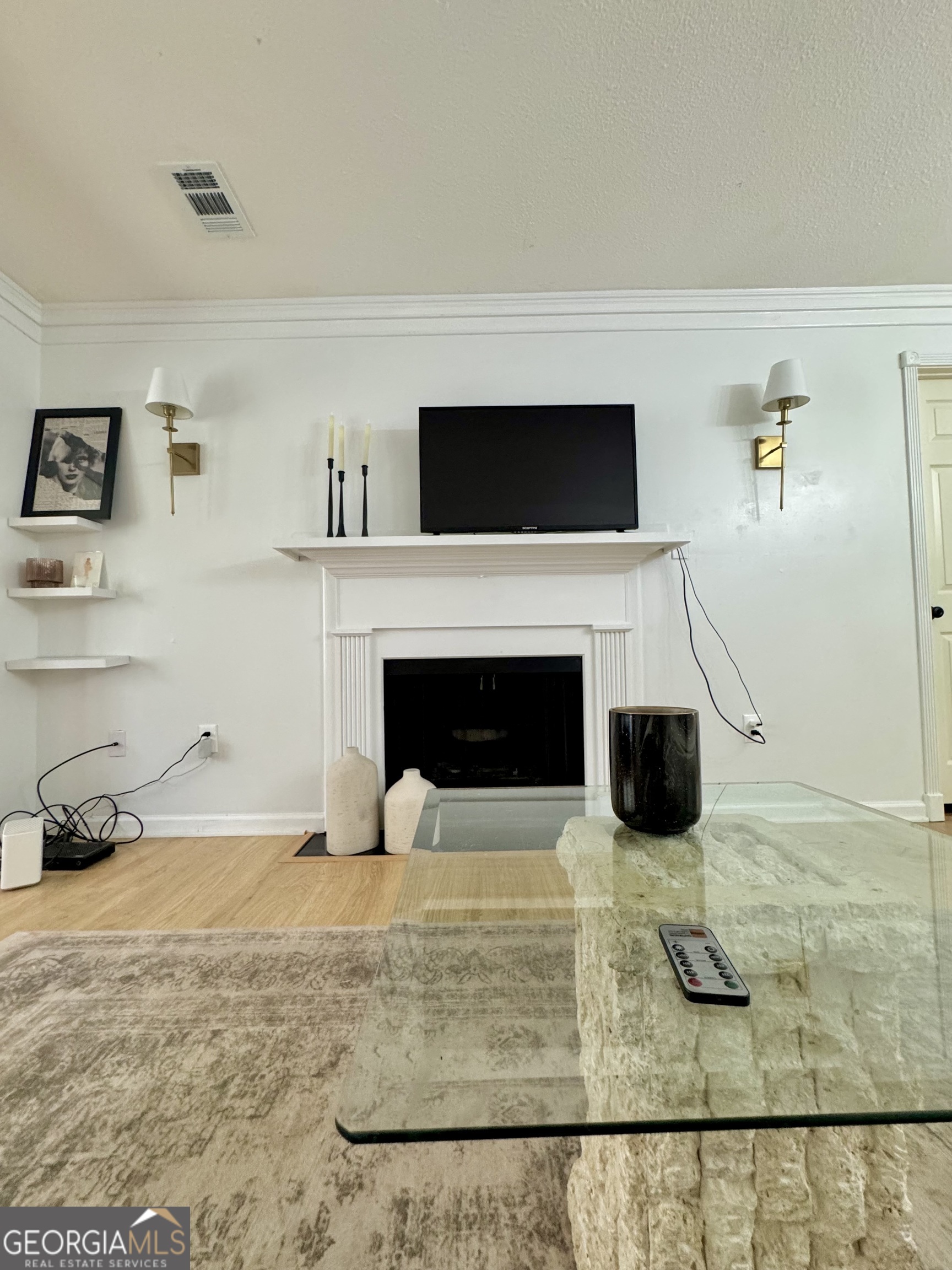 24311 Plantation Drive Northeast, Unit 311 Atlanta, GA 30324 - Photo 12 of 36 a living room with furniture and a fireplace