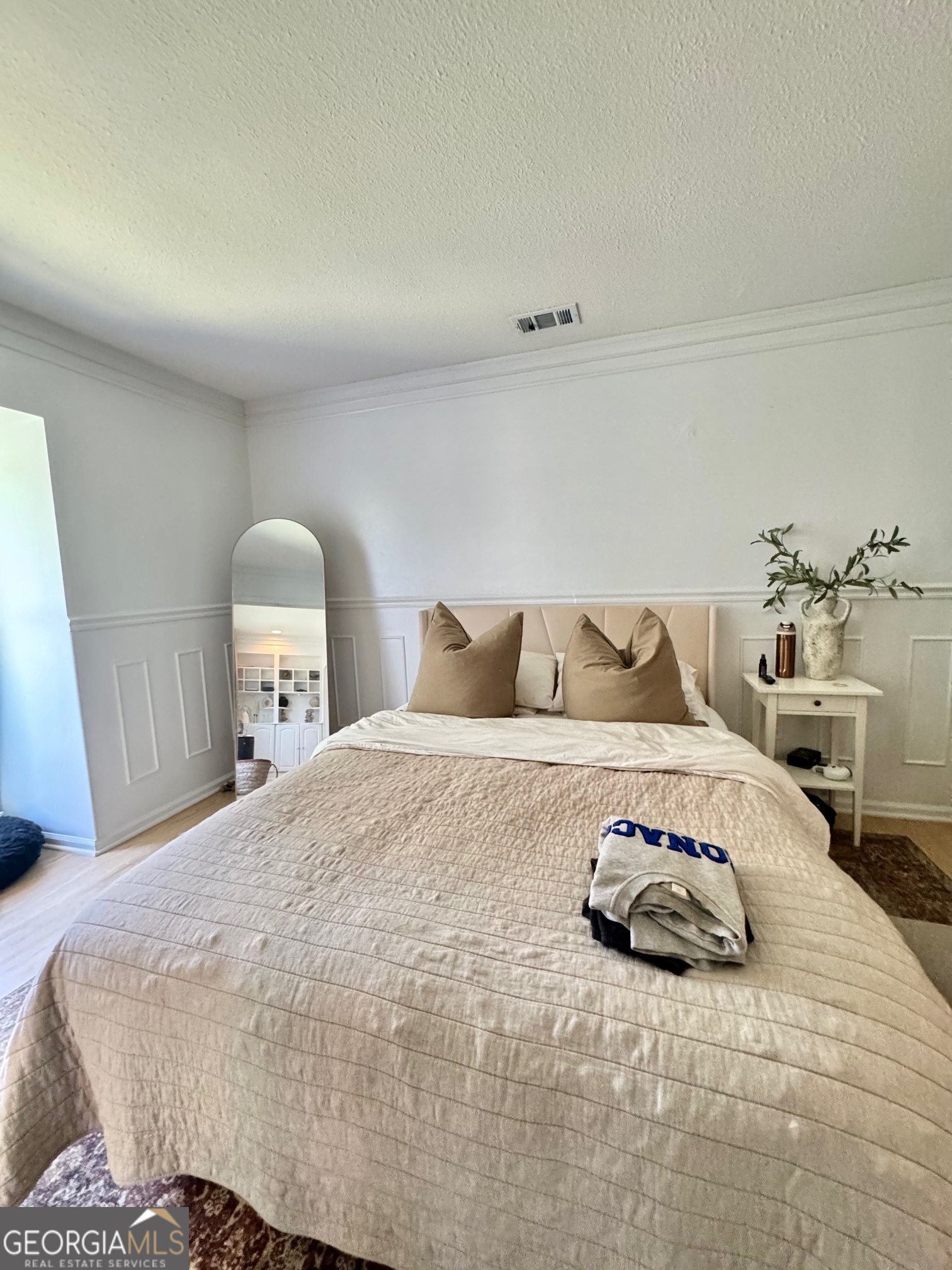 24311 Plantation Drive Northeast, Unit 311 Atlanta, GA 30324 - Photo 14 of 36 a bedroom with a bed and window