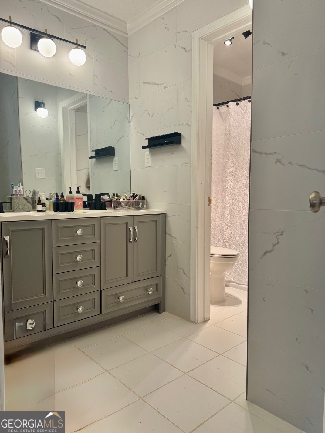 24311 Plantation Drive Northeast, Unit 311 Atlanta, GA 30324 - Photo 24 of 36 a kitchen with a refrigerator and cabinets