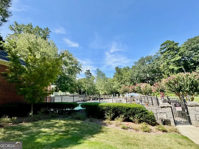 a view of a lake with a yard