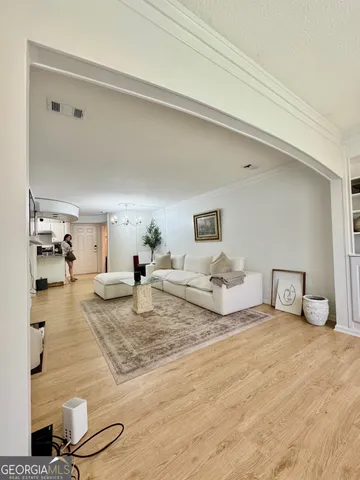 a living room with furniture and a table