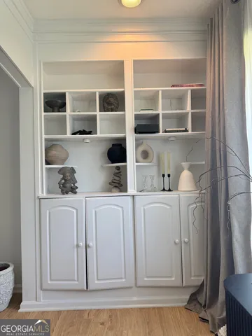 a kitchen with a cabinets and a window