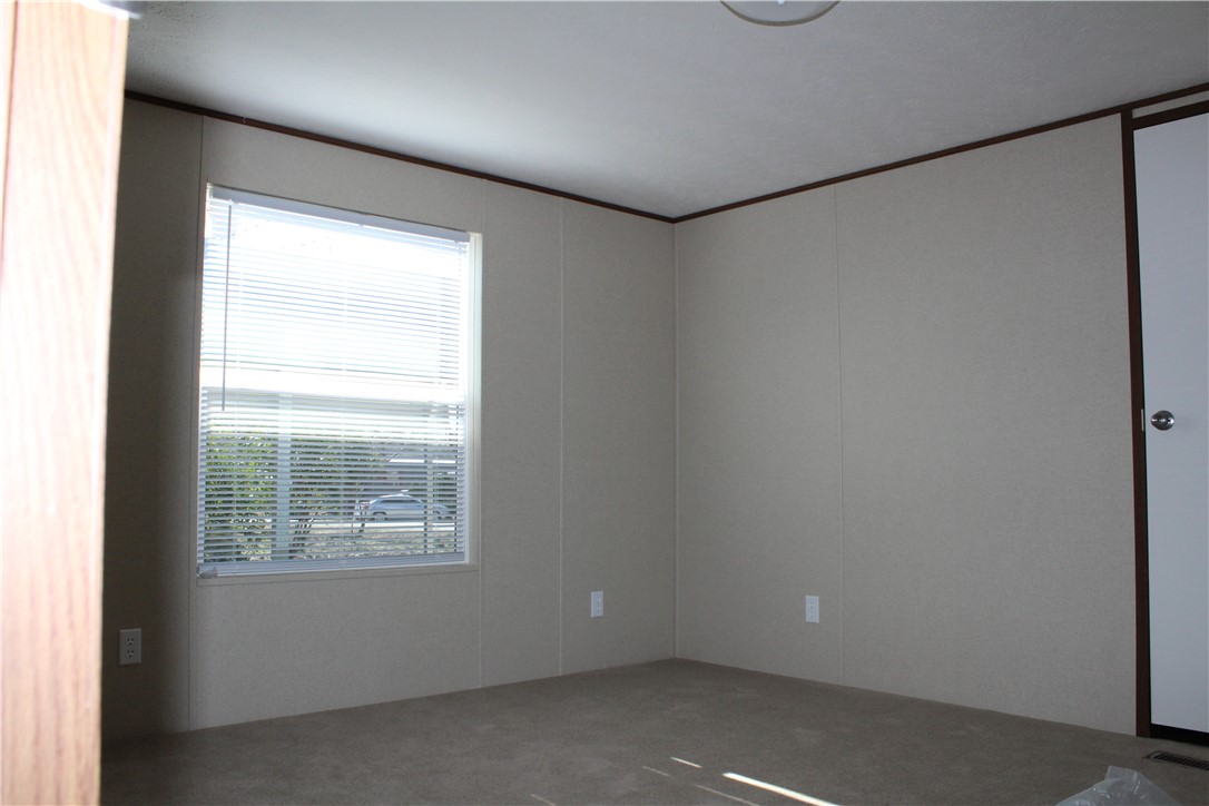 119 Royal Street Taylor, TX 76574 - Photo 15 of 18 a view of an empty room with a window