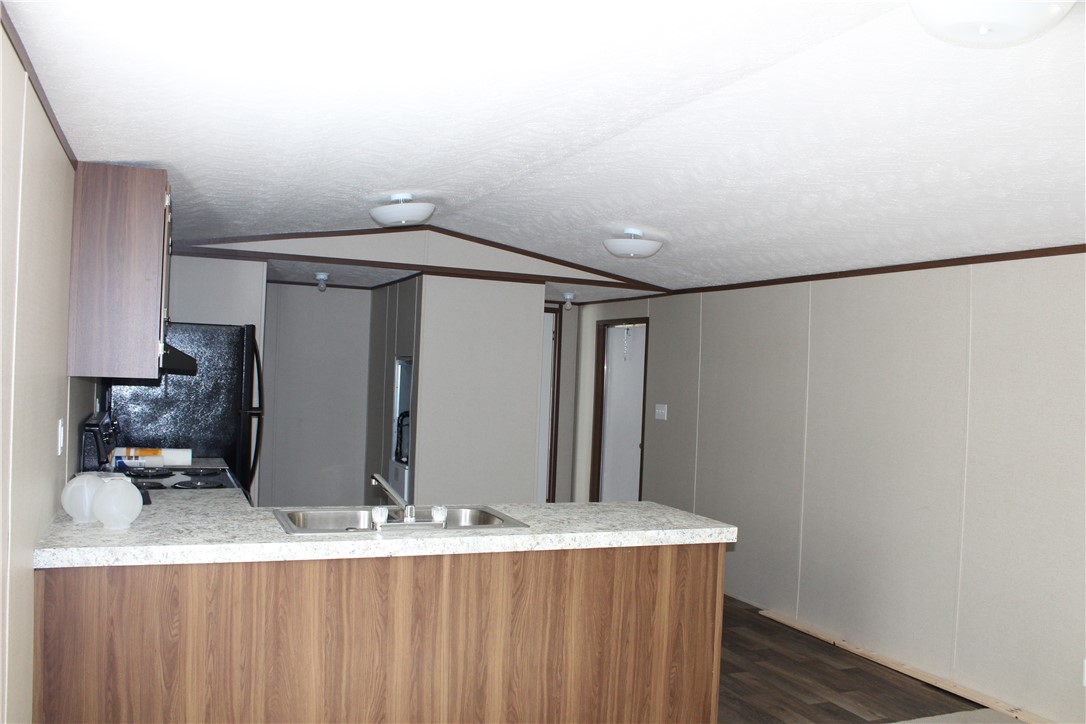 119 Royal Street Taylor, TX 76574 - Photo 10 of 18 a bathroom with a granite countertop sink and a mirror