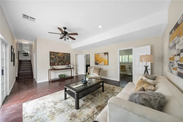 a living room with furniture and a table
