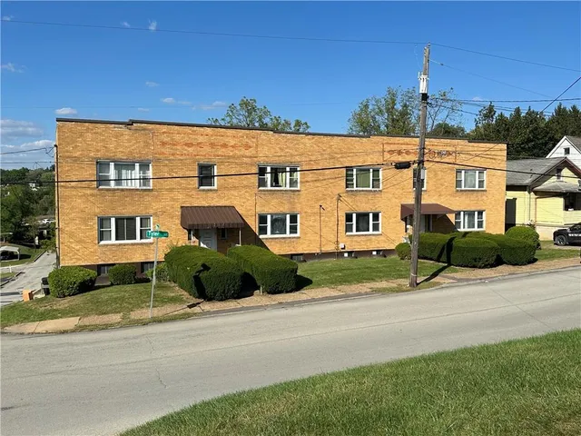 front view of a house with a street