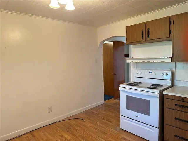 a kitchen with a stove and a microwave